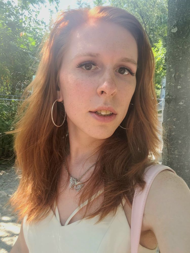 krystal swords with surprisingly little makeup and a white dress 