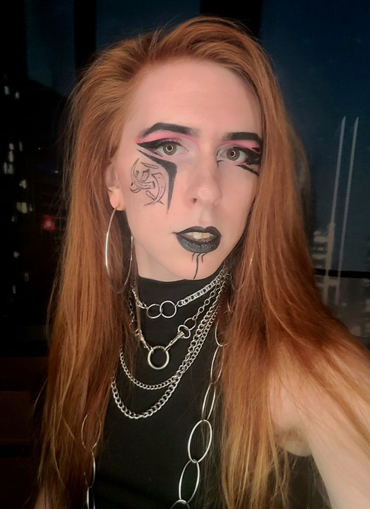 krystal swords with graphic liner black top and silver chains
