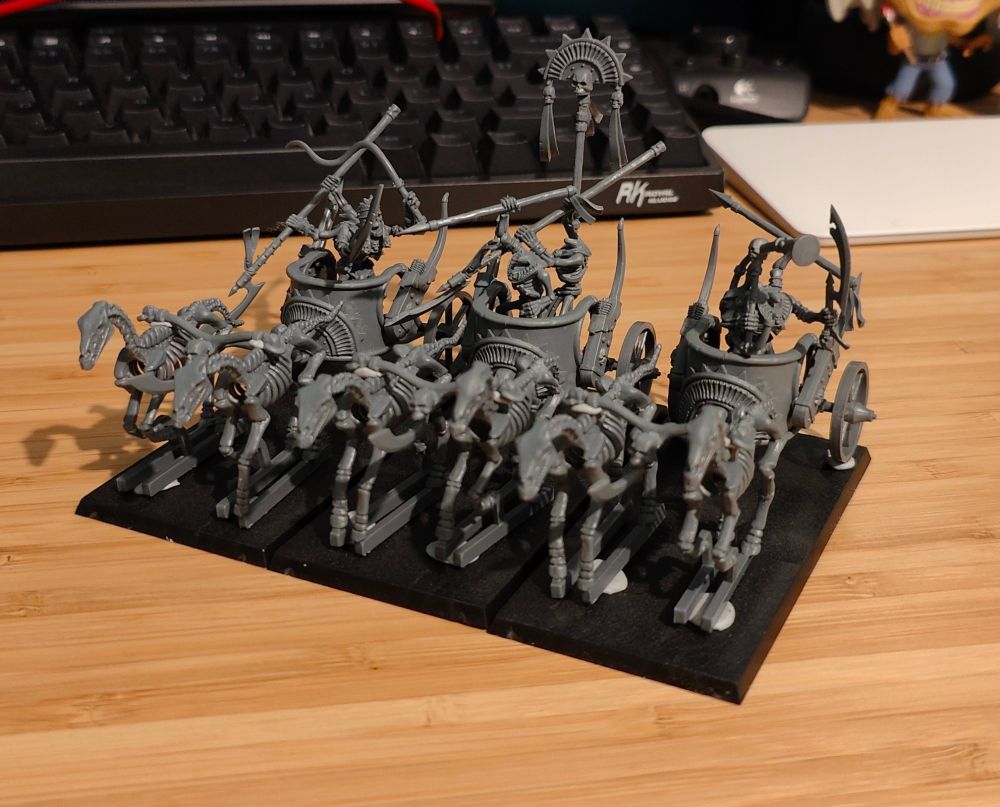 3 skeleton chariot miniatures for Warhammer Fantasy Battle / Warhammer The Old World.

Each chariot is pulled by two skeleton horses, with two skeletons on board each chariot. 