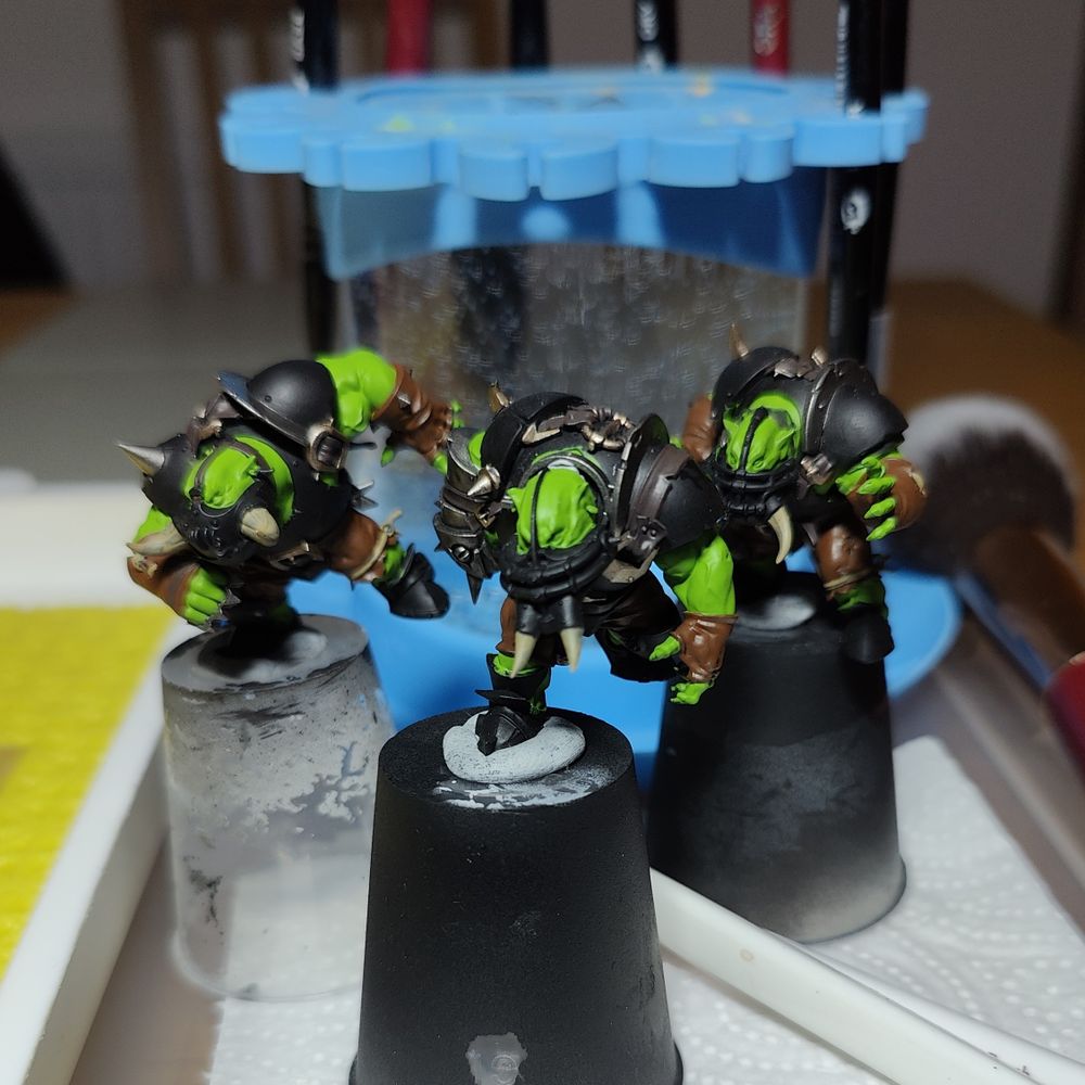 Three Black Orc miniatures for the Blood Bowl tabletop game.