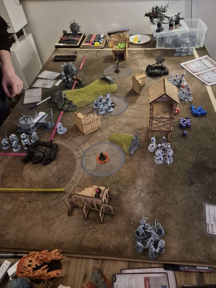 Set up for a game of Warhammer Age of Sigmar.

Ogors on the left face Daughters of Khaine on the right. 