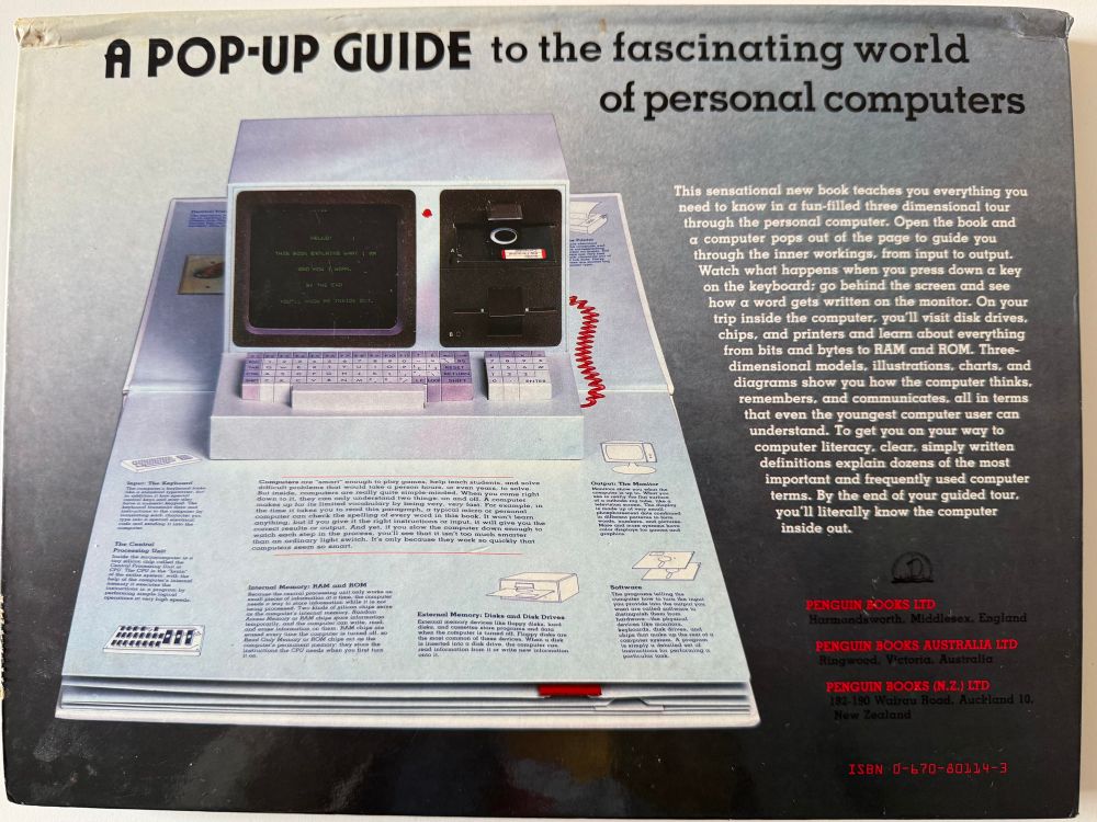 Backside of the book. It shows a picture of the first page with a pop-up model of the computer from the front cover. The floppy disk can be pushed in and the drive can be closed with a flap. Moving the flap will make a different text appear on the monitor.
There is also a description of the contents: „This sensational new book teaches you everything you need to know in a fun-filled three dimensional tour through the personal computer. Open the book and a computer pops out of the page to guide you through the inner workings, from input to output. Watch what happens when you push down a key on the keyboard; go behind the screen and see how a word gets written on the monitor. On your trip inside the computer, you’ll visit disk drives, chips, and printers and learn about everything from bits to bytes to RAM and ROM. Three-dimensional models, illustrations, charts, and diagrams show you how the computer thinks, remembers, and communicates, all in terms that even the youngest computer user can understand. To get you on your way to computer literacy, clear, simply written definitions explain dozens of the most important and frequently used computer terms. By the end of your guided tour, you’ll literally know the computer inside out.“