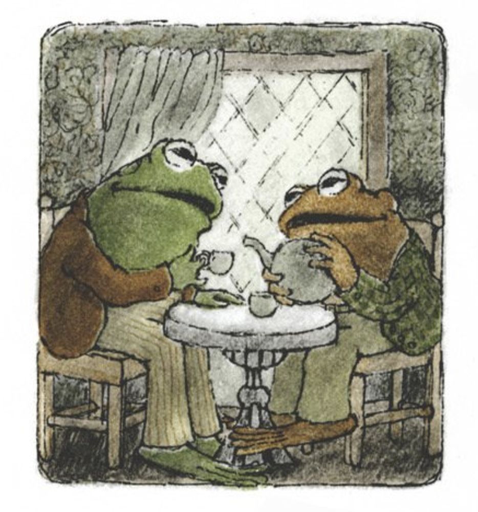 Frog and Toad sit at a cozy table having a cup of tea.

From ""
In *Frog and Toad Are Friends*