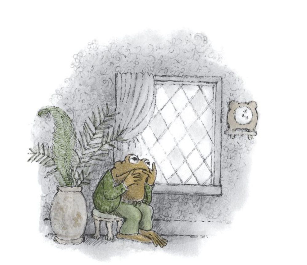 Toad sits on a stool, glumly looking out the window while he tries to think of a story.

From "The Story"
In *Frog and Toad Are Friends*