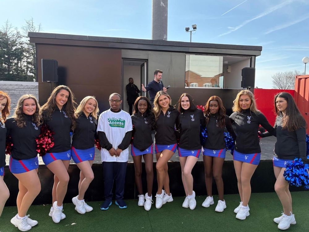 Young dsa member in unite for access t-shirt with the crystals cheerleaders
