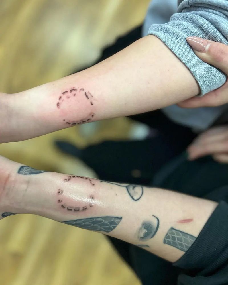 Matching bite mark tattoos 