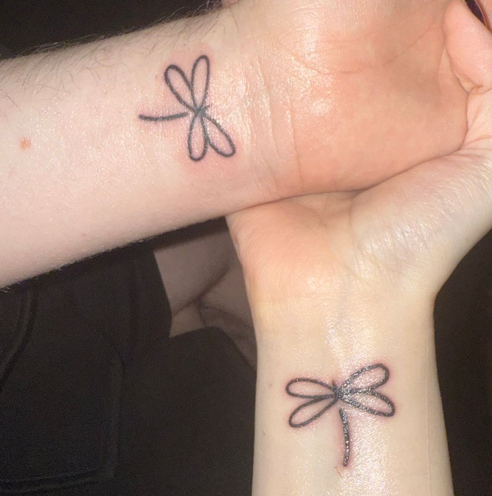Ghore and Prismas matching dragonfly tattoos 