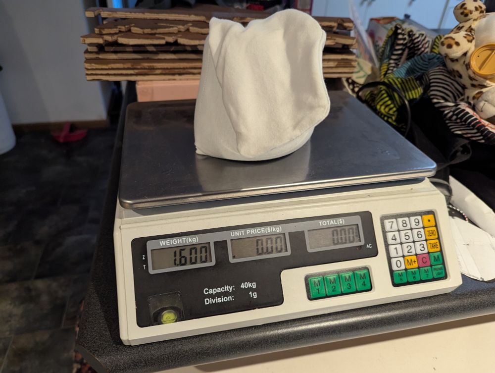 Pouch on scale reading 1.6 kilograms. 