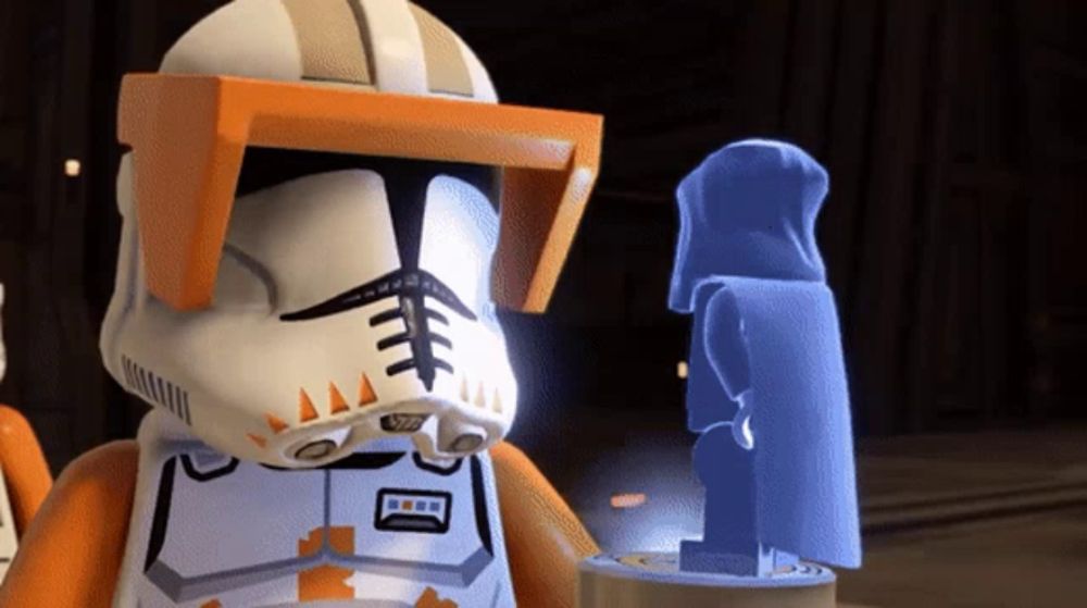 a lego clone trooper stands next to a statue