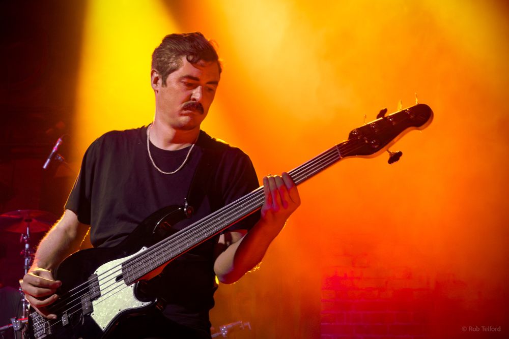 Dylan plays a five string bass