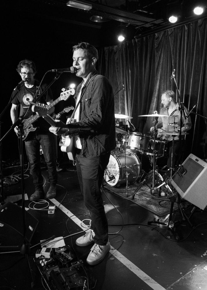 Black and white photo of The Dreaming Spires on stage