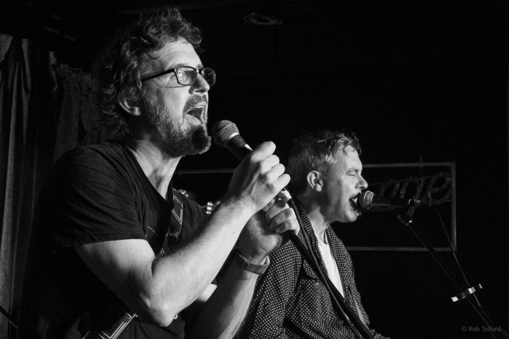 Black and white photo of The Dreaming Spires on stage