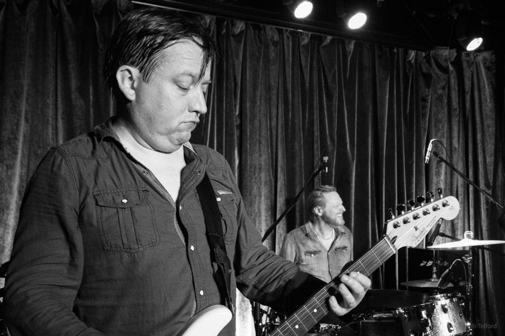 Black and white photo of The Dreaming Spires on stage