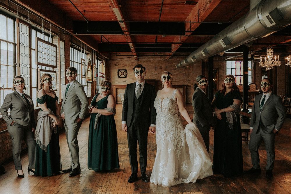 A photo of my wedding party.  Everyone is wearing a mask and scheming.