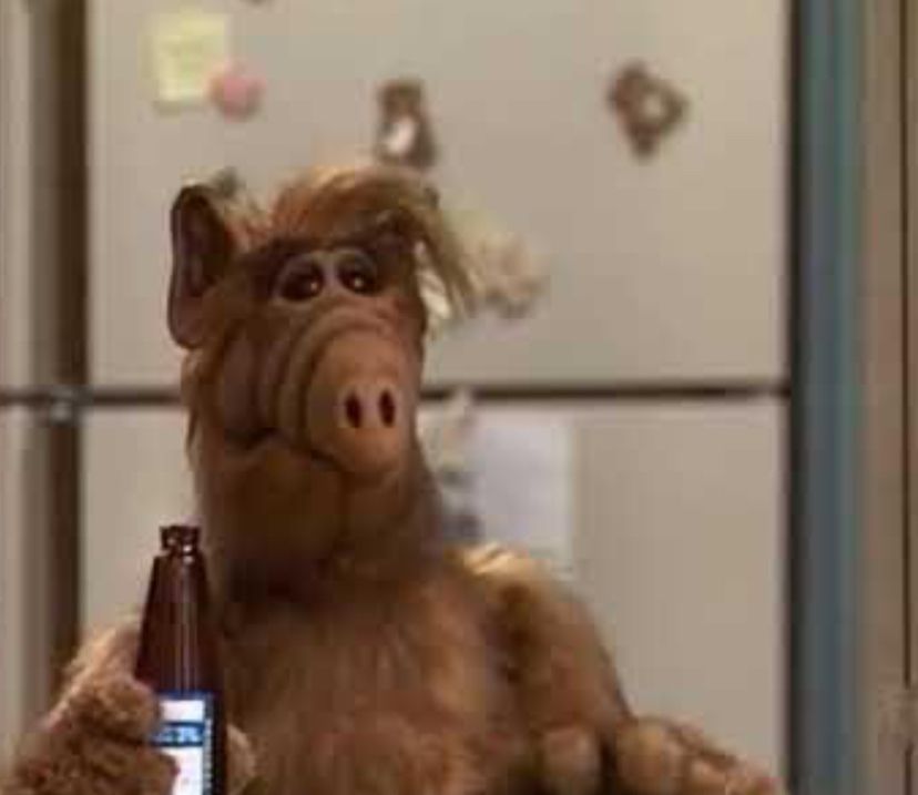 Picture of Alf, holding a beer