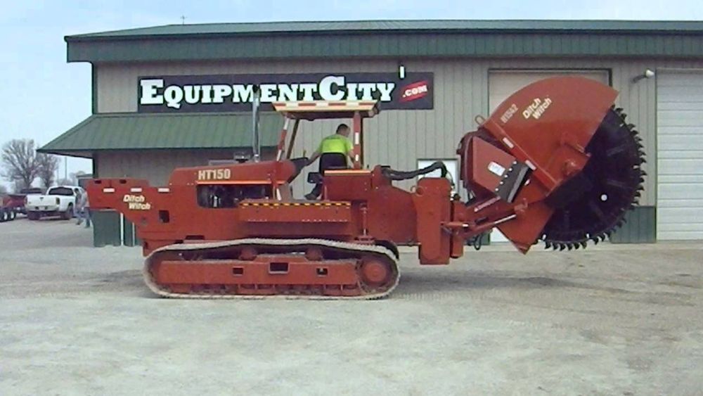 A tractor with a giant circular blade on one end