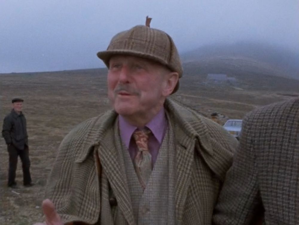 Michael Powell on the Foula airstrip, in tweeds and a deerstalker