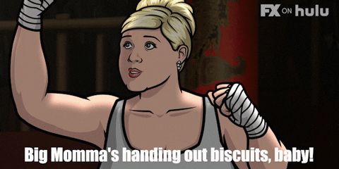 Gif of Pam from Archer getting ready to hand out biscuits 