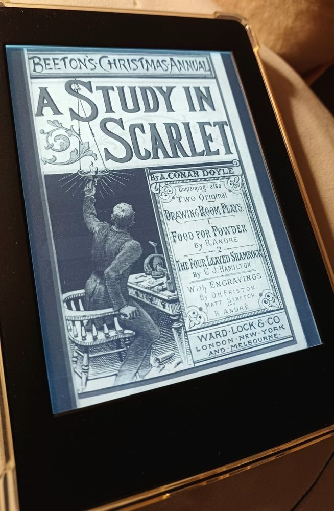kindle with cover of 'A study in scarlet' by Conan Doyle on display