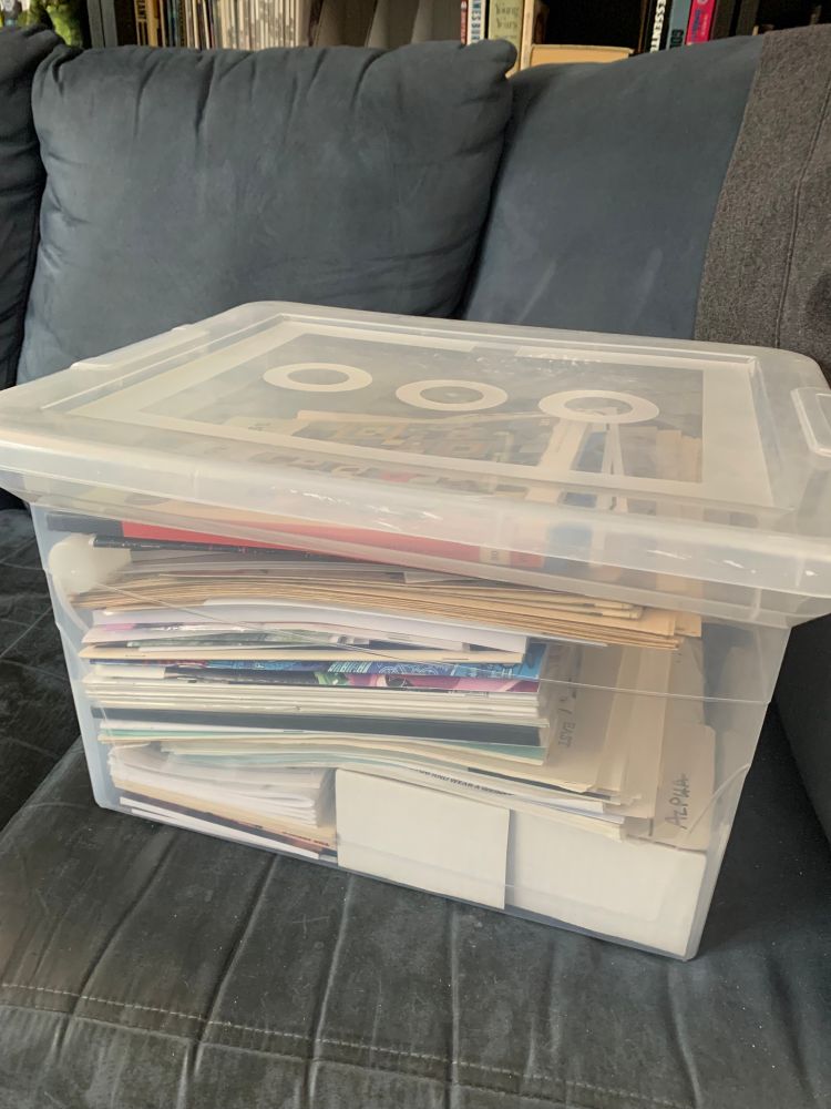 A bin full of zines and books and ephemera