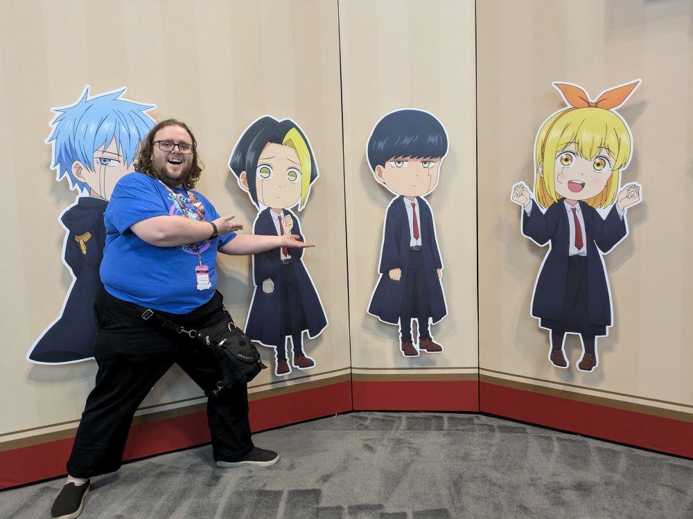 Me at a Mashle booth at comic con
