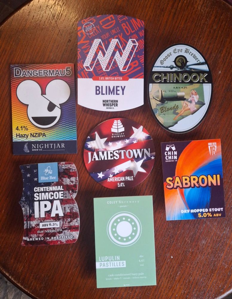 7 pump clips on a wooden table