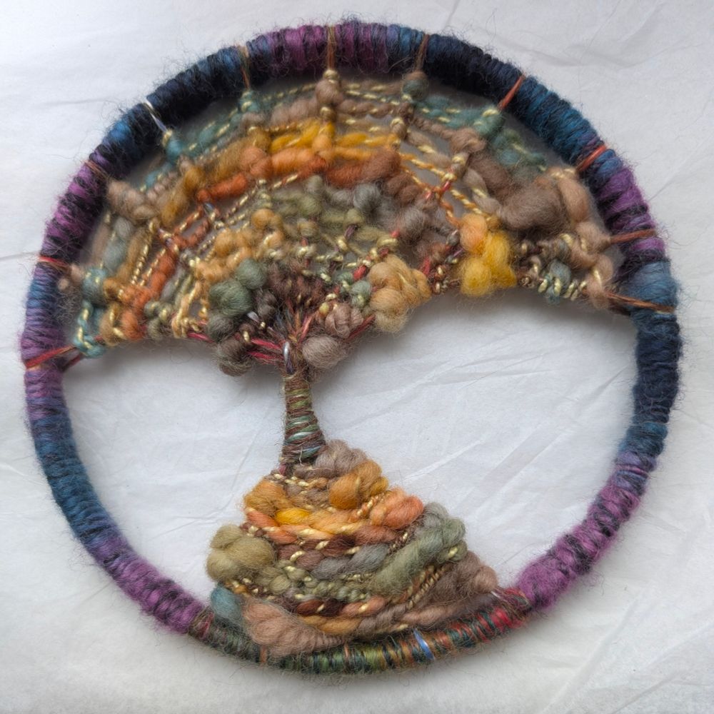 Tree in a hoop, made with hand spun wool using Dorset button making techniques.