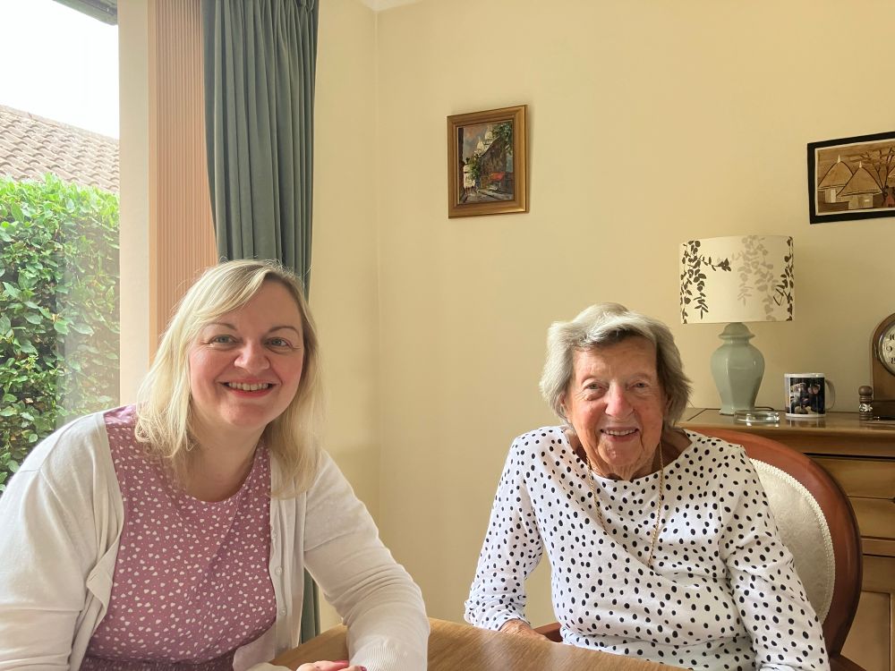 Jo and Yvonne sitting at a table 
