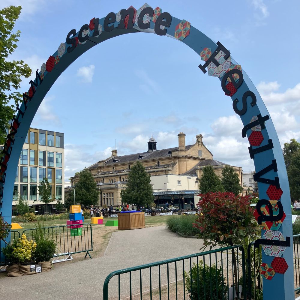 An archway into the gardens that says Cheltenham Science Festival 