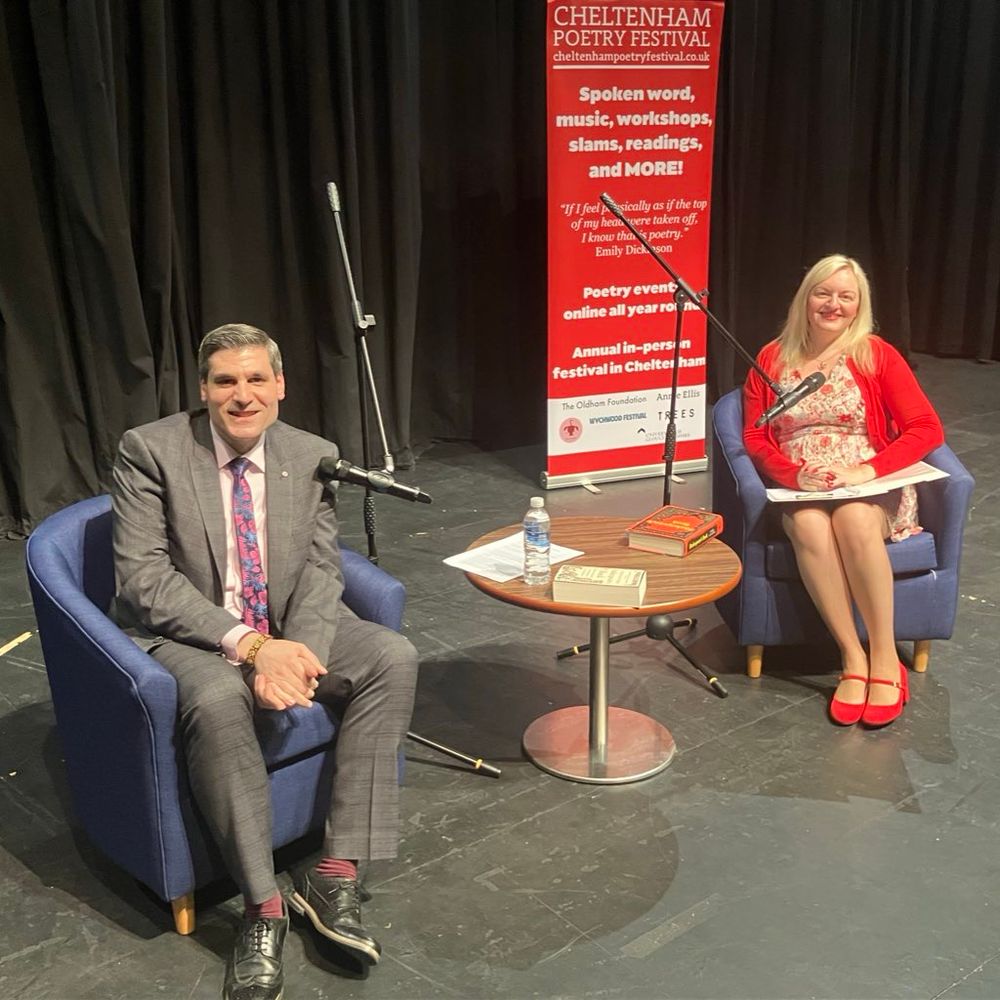 Chris and Jo on stage at the 2024 Cheltenham Poetry Festival 