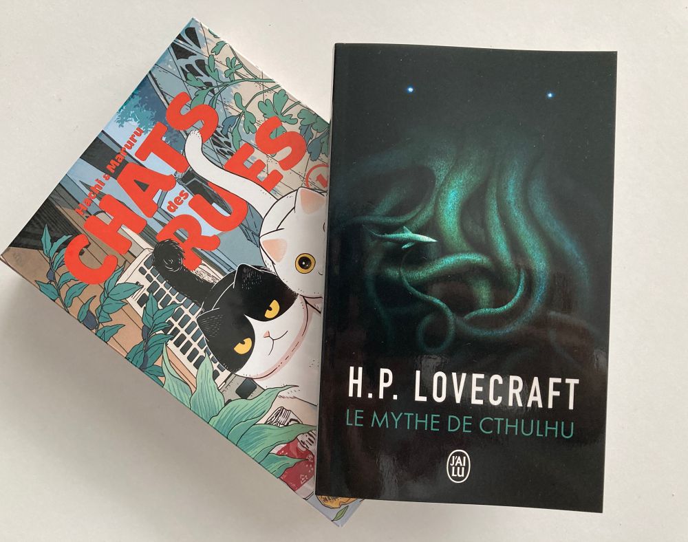 Two books on a white background, a manga “Hachi & Maruru” by Yuri Sonoda, and a novel “Cthulhu’s myth” by H.P. Lovecraft 