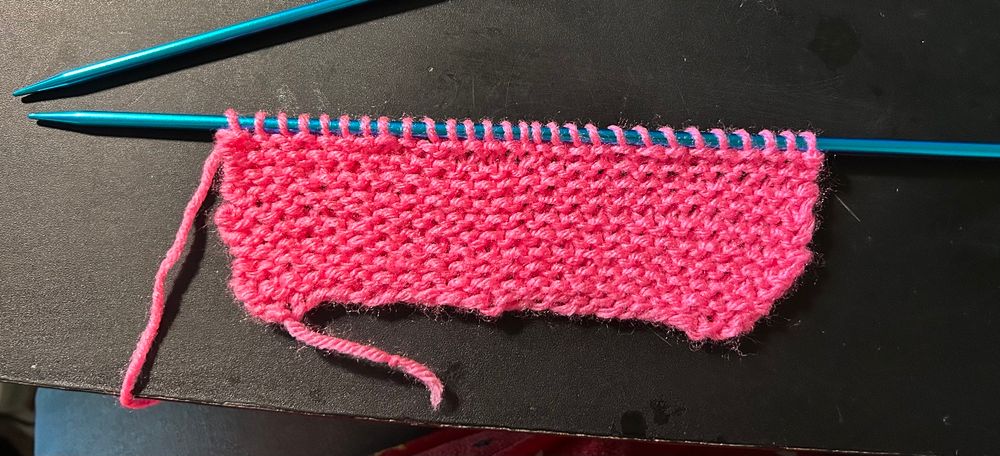 A lovely pink yarn knitted on a 5.0 mm knitting needle.