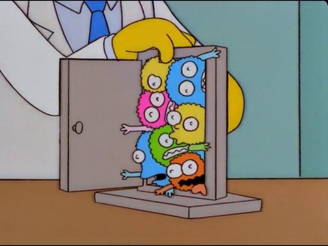 A scene from The Simpsons with a doctor showing a bunch of cute, squishy, deadly germs jammed together in a doorway 