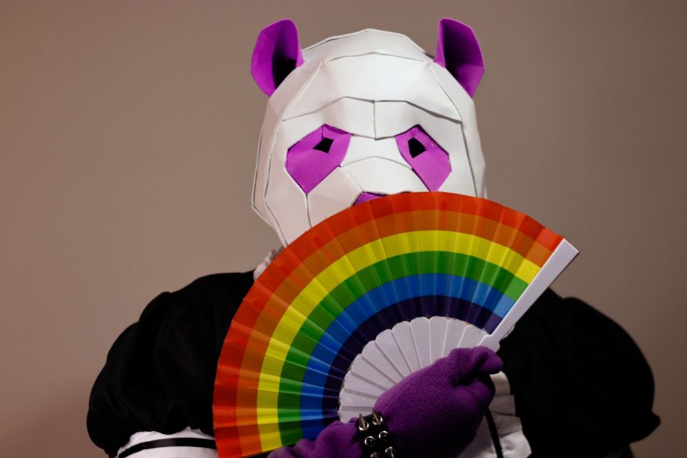Me with my purple panda furhead wearing a maid dress and with a gay fan in my hand