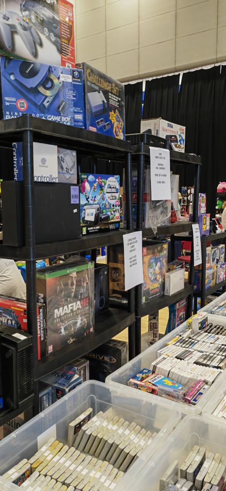 Another photograph of some video game consoles in the market.