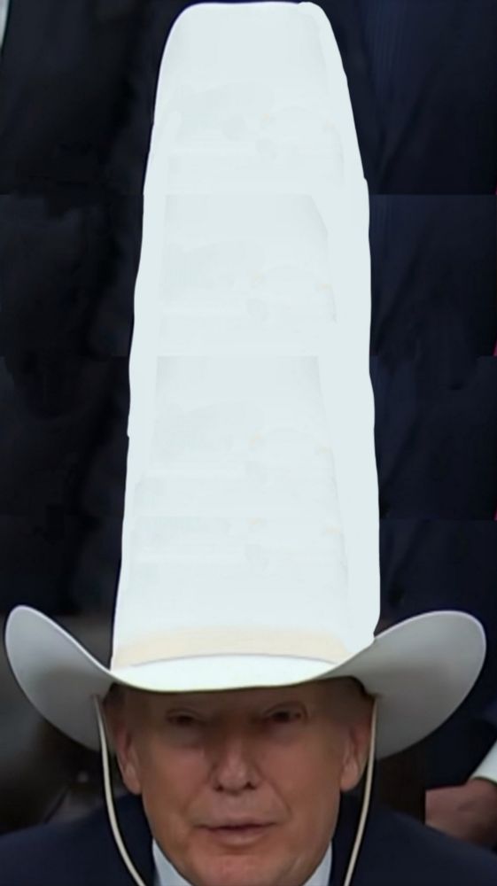 Trump in longer cowboy hat 