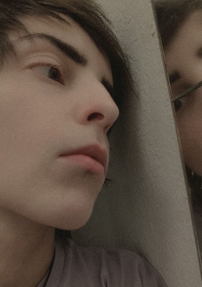 A picture of me looking absentmindedly into a mirror