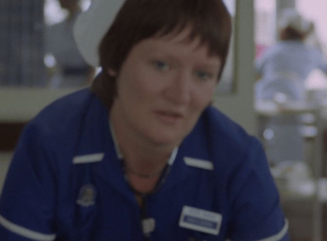 ChatGPT describes the image as "A nurse wearing a blue uniform and white trim is prominent in the foreground, her expression serious and attentive, suggesting a moment of interaction or concern. The setting appears to be a hospital or clinical environment, with blurred medical staff and white furnishings visible in the background. The lighting is natural, with daylight filtering through windows, giving a sense of routine healthcare activity amidst the tension implied by the nurse's focused demeanor. This scene likely depicts a moment of care or the delivery of important information in a hospital context."

BotOfDarkness, version 2.0.23. AWS Lambda version: 1.14.