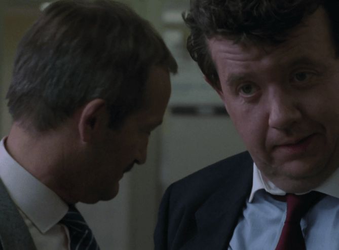 ChatGPT describes the image as "The image captures a tense, intimate moment between two male characters engaged in a serious conversation. Both men are dressed in formal business attire, hinting at a professional or governmental setting. The man on the right looks directly at the camera with a concerned and contemplative expression, while the man on the left, partially turned away, appears focused and somewhat wary. The dim lighting and close framing emphasize the gravity of their discussion, suggestive of unfolding political or corporate intrigue central to the narrative. The setting, likely an office or institutional space, reflects the show's themes of conspiracy and moral ambiguity."

BotOfDarkness, version 2.0.23. AWS Lambda version: 1.14.