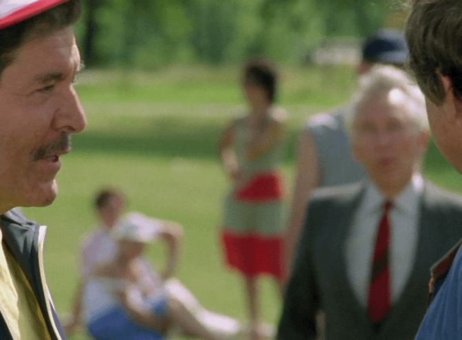 ChatGPT describes the image as "The image depicts a tense outdoor encounter among a small group of people in a park-like setting, with blurred greenery and other individuals in the background. The focus is on two men facing each other, one on the left with a serious expression, and the other on the right partially visible. A woman in a gray suit with a red tie stands between them, observing the interaction. Behind, a woman in a colorful dress is visible, standing with her hands on her hips, while another person relaxes on the grass in the distance. The scene suggests a moment of confrontation or intense conversation amid a leisurely outdoor gathering."

BotOfDarkness, version 2.0.23. AWS Lambda version: 1.14.