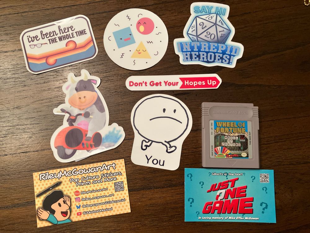 Stickers from RileyMcGowanArt and the Wheel of Fortune game for the Gameboy from Just One Game