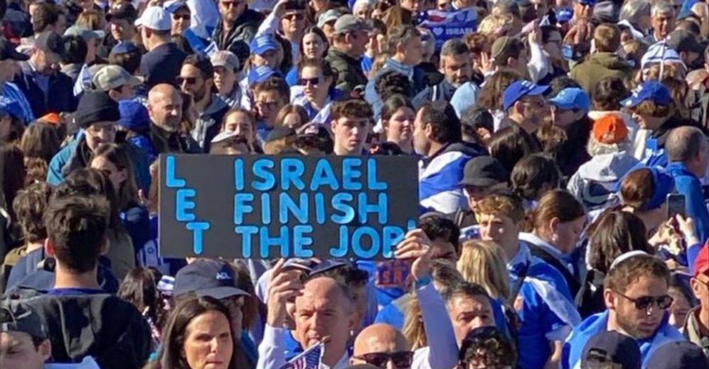 Photo of a sign that says let Israel finish the job