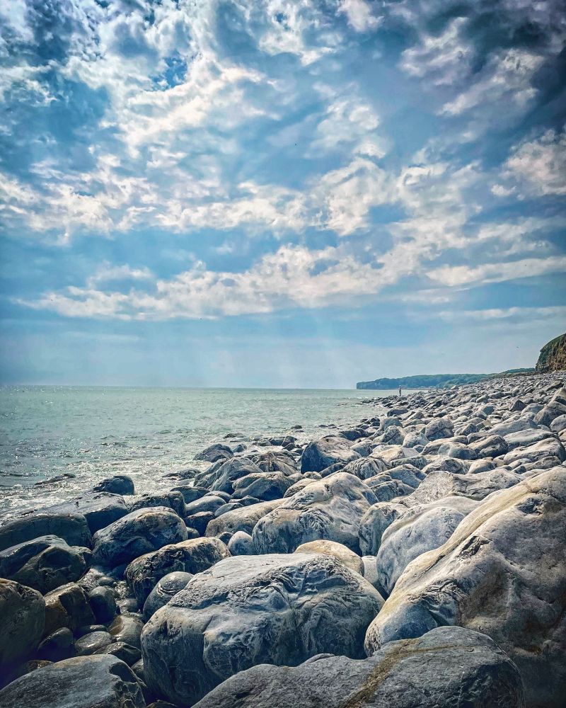 Atmospheric clouds over Llantwit Major beach, looking towards Nash Point.