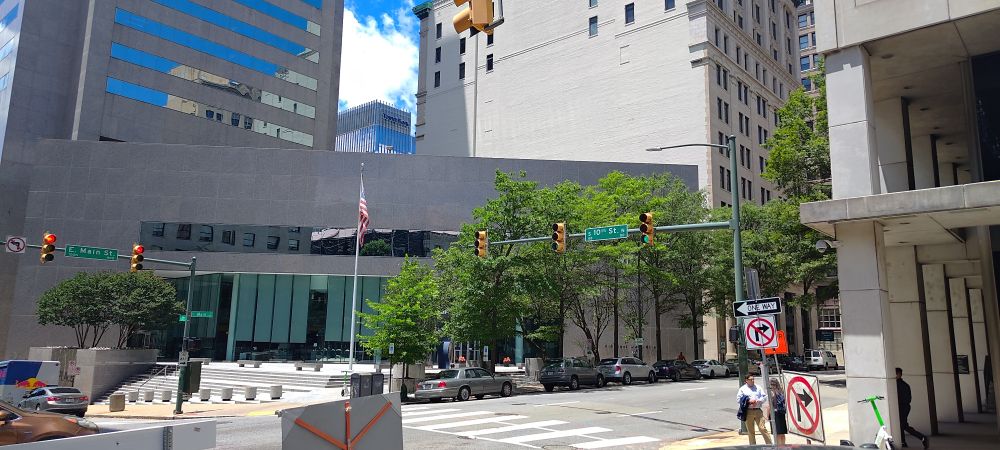 A photo looking west from the intersection of 10th and Main in Richmond VA. The modern Truist building takes up most of the view.