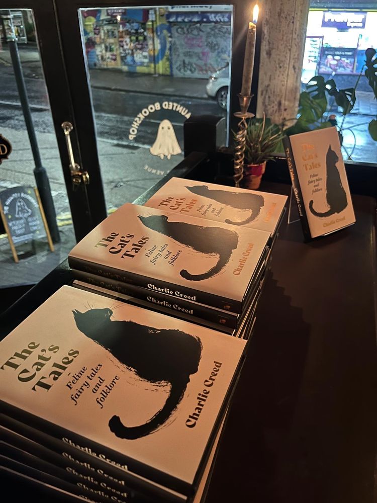 A pile of The Cat's Tales: Feline Fairy Tales and Folklore on display in The Haunted Bookshop, Bristol