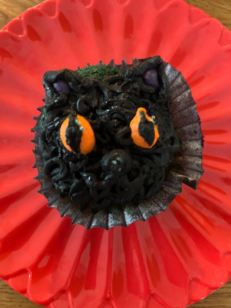 A cupcake shaped like a cat