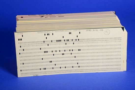 a thick deck of IBM computer punch cards
