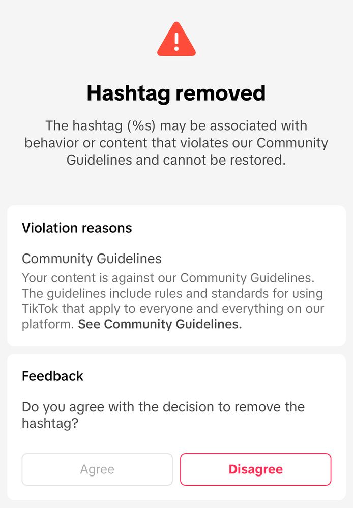 A screen shot of a community guidelines violation for #libraryofalexandria from TikTok 