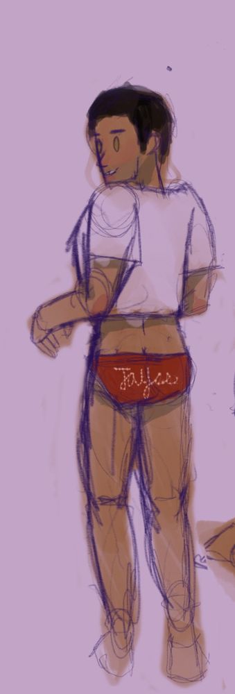 Jayce dressed up in a pair of red panties that say his name on them and a boxy T-shirt