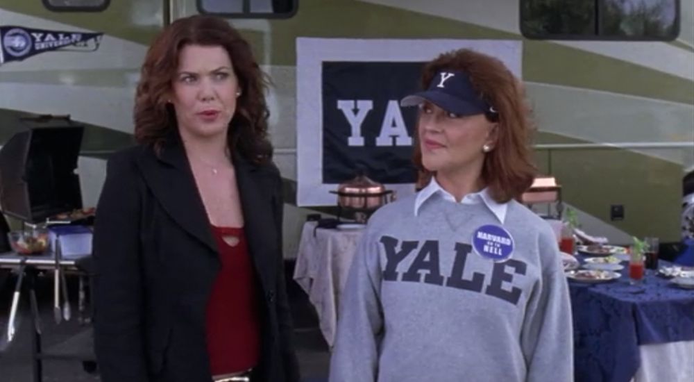 Emily and Lorelei Gilmore at the Yale game, with Emily wearing a HARVARD GO TO HELL pin